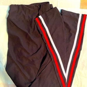 Black leggings with white and red stripe